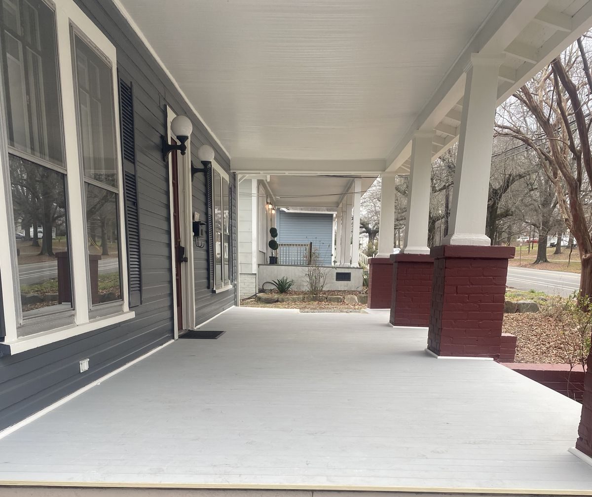 Covered front porch with refinished decking and columns