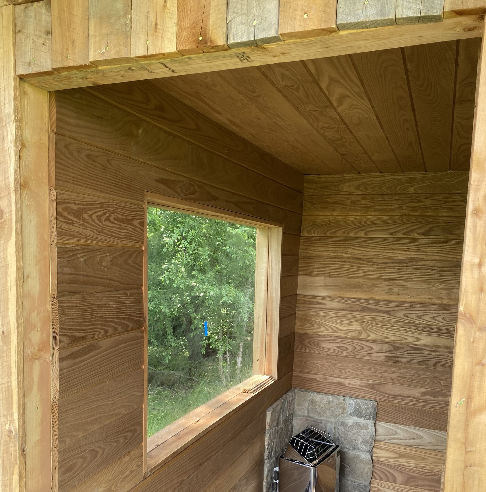 Tongue-and-groove wood-clad window nook